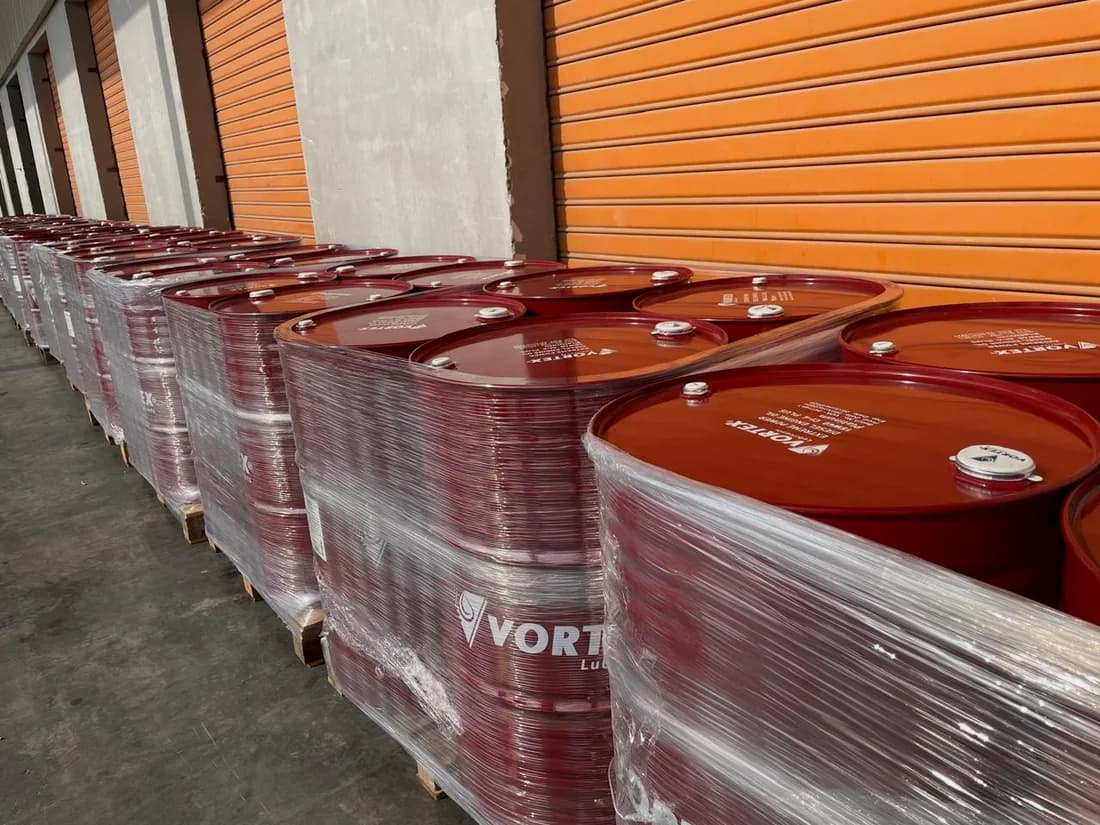 Row of red Vortex drums lined up against the plant shutters